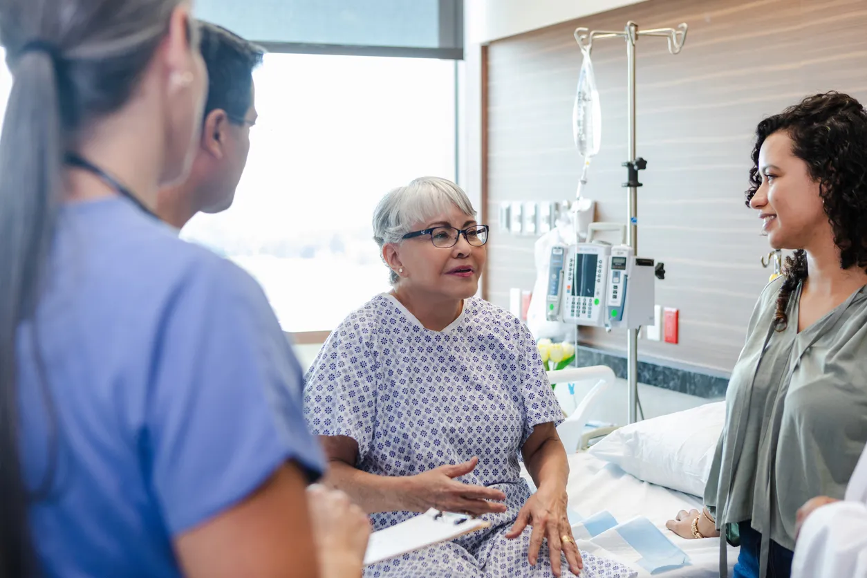Elderly woman receiving medical procedure